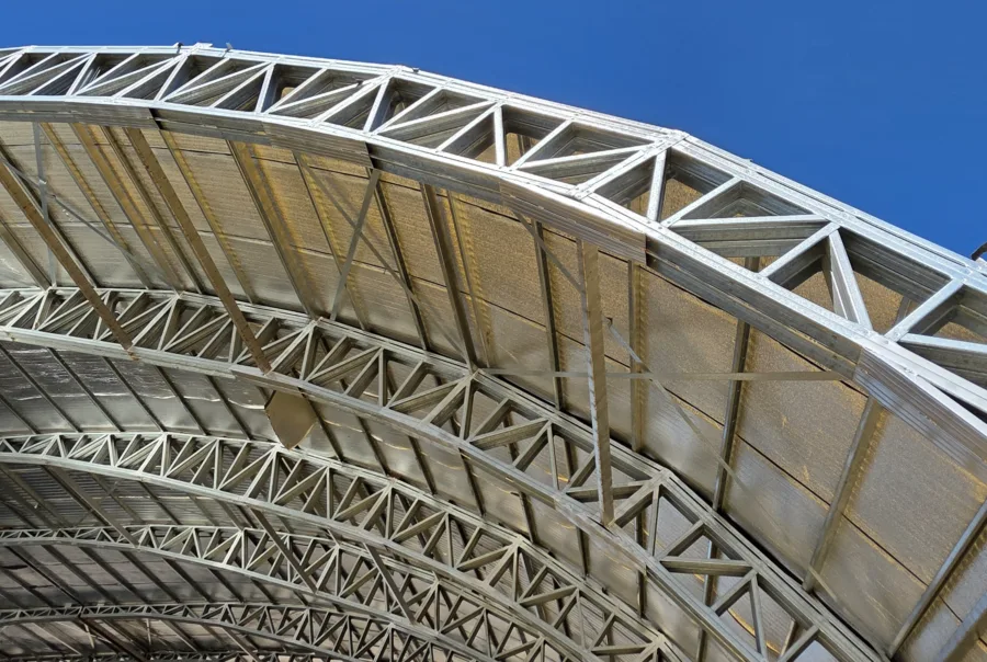 Curvilinear modular cold-formed steel commercial structure produced using Scotpanel 7090G1 advanced roll forming platform, developed and produced using Scotpanel 7090G1.