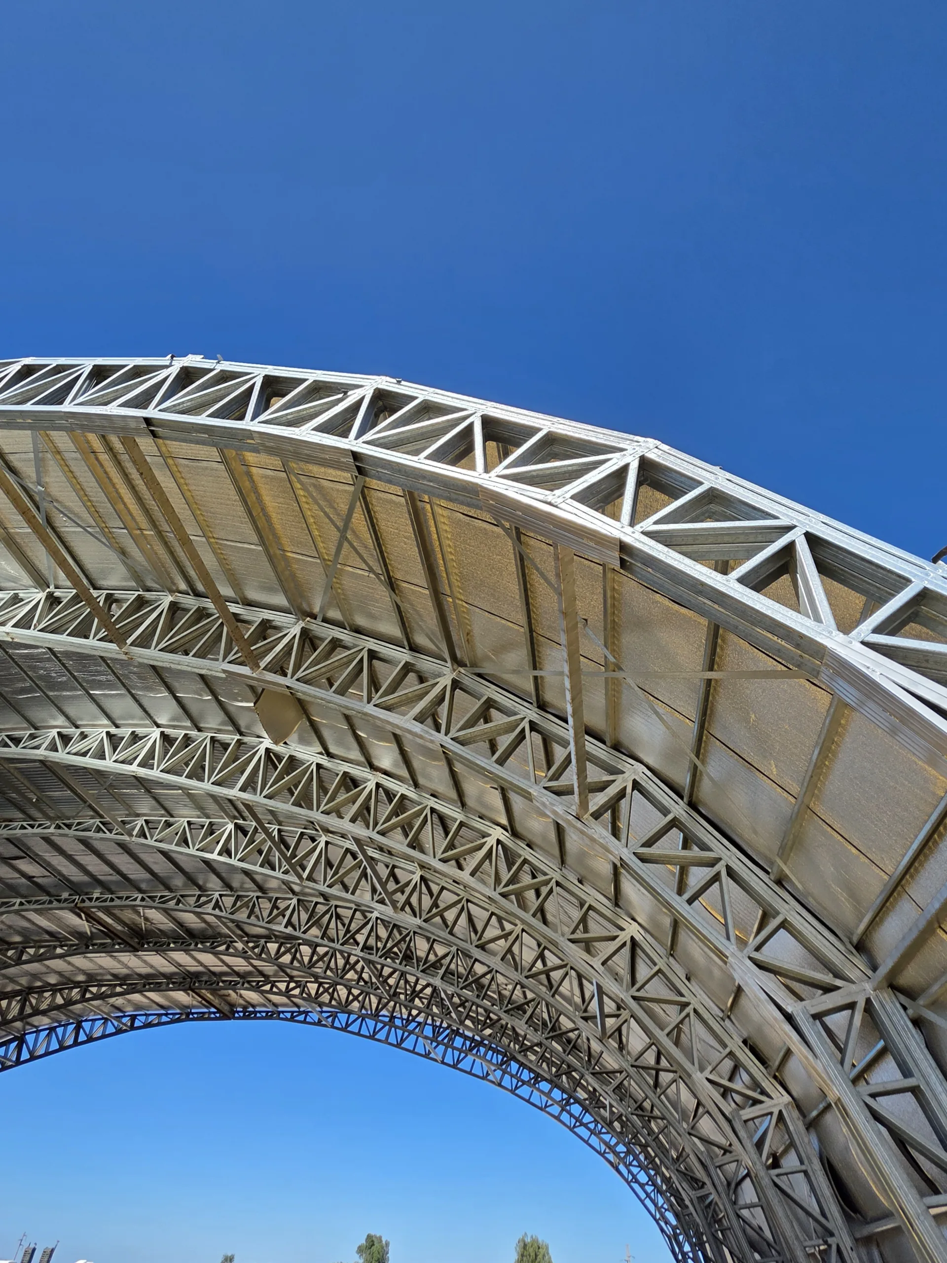 Curvilinear modular cold-formed steel commercial structure produced using Scotpanel 7090G1 advanced roll forming platform, developed and produced using Scotpanel 7090G1.