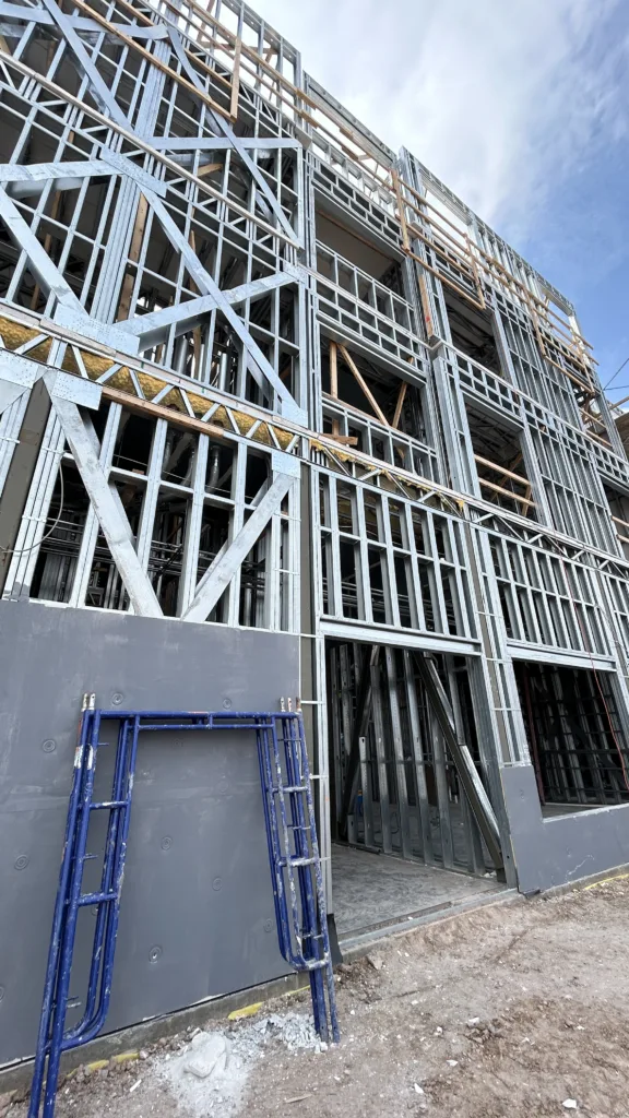 image00033 - Scottsdale Construction Systems Steel-framed building under construction with exposed metal studs and diagonal bracing